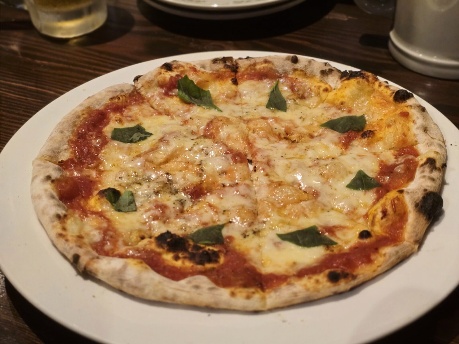Thin-crust Margherita pizza with basil