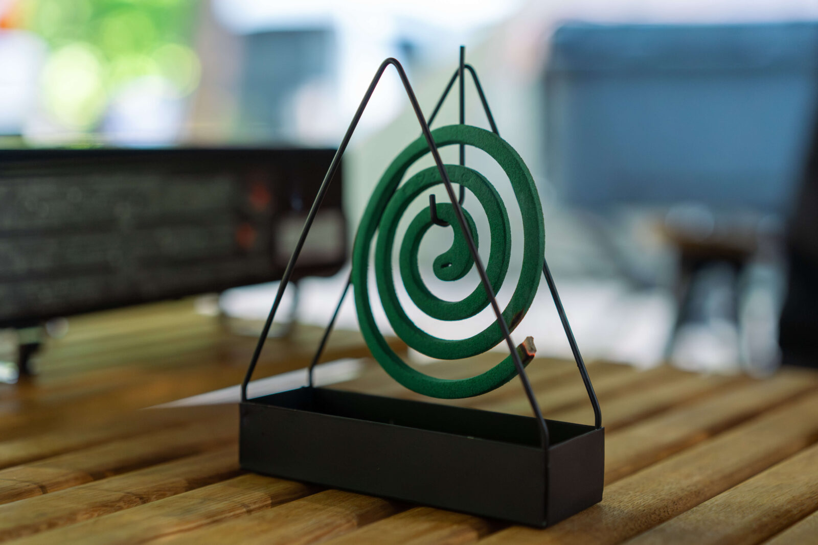 Japanese mosquito coil (katori senkō) burning on a camping table to keep bugs away in summer.